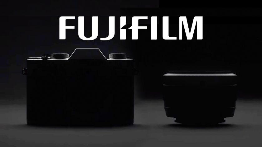 Silhouetted image of a Fujifilm camera and lens with the Fujifilm logo floating above