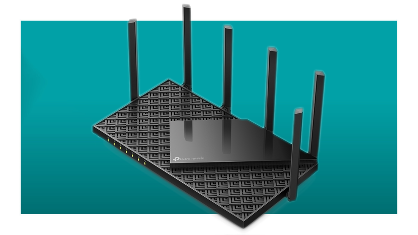 The TP-Link Archer AXE75 WiFi 6E router floats in a void.