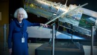 Nancy Grace Roman stands next to a scale model of the Hubble Space Telescope outside the Hubble control center at NASA’s Goddard Space Flight Center in Maryland. Roman is known as the “Mother of Hubble.”