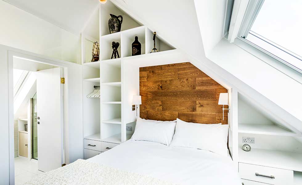 vaulted ceiling adds height to small bedroom