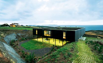 Exterior of building on cliff looking out to sea