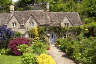 Burpee's tips for growing the perfect cottage garden: path leading to houses