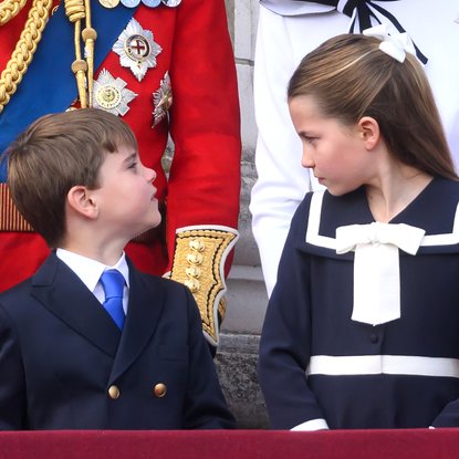 Prince Louis of Wales and Princess Charlotte of Wales on the balcony of Buckingham Palace during Trooping the Colour on June 15, 2024 in London, England. 