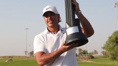 Brooks Koepka with the LIV Golf Jeddah trophy