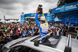 Peter Sagan (Tinkoff-Saxo) shows off his trophy and new car after winning the overall
