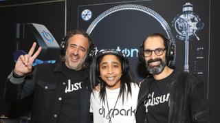 (left to right) James “JC” Curleigh (CEO of Gibson Brands), DJ Spark, and Cesar Gueikian (Chief Merchant Officer of Gibson Brands) at the Stanton booth during the 2019 NAMM Show wearing Stanton’s new SDH 6000 PRO Wireless headphones which incorporate SKAA Pro® wireless technology.