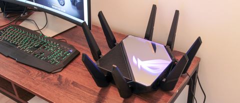 Asus ROG Rapture GT-AXE16000 gaming router on a desk