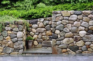 stone garden wall with concealed steps
