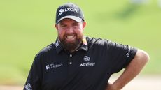 Shane Lowry of Ireland smiles whilst leaving the 18th green following a practice round prior to the DP World Tour Championship on the Earth Course at Jumeirah Golf Estates on November 15, 2023 in Dubai, United Arab Emirates.