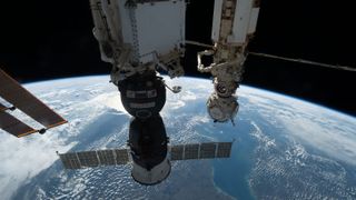 The Russian-built Soyuz MS-22 spacecraft is seen in the foreground docked to the Rassvet module of the International Space Station in this image taken in October. 2022. Russia's Nauka laboratory module of the station is seen in the background, with its European Robotic Arm folded up.