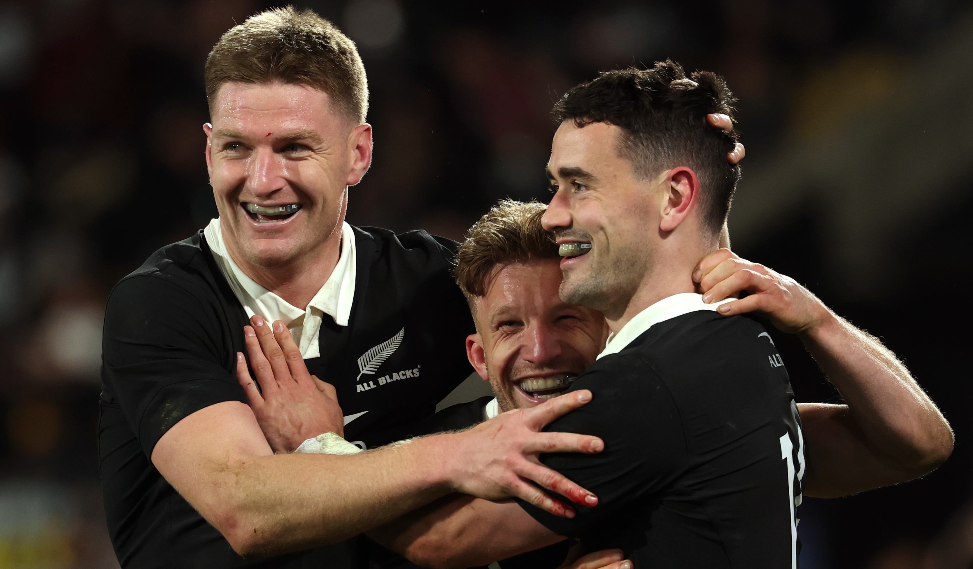 Will Jordan celebrates scoring New Zealand's fifth try with Damian McKenzie and Jordie Barrett in the Nations Championship match with Italy at Hnry Stadium on July 11, 2026 in Wellington, New Zealand