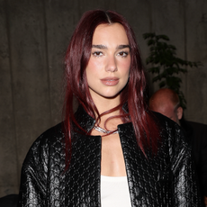 dua lipa wears an embossed leather jacket