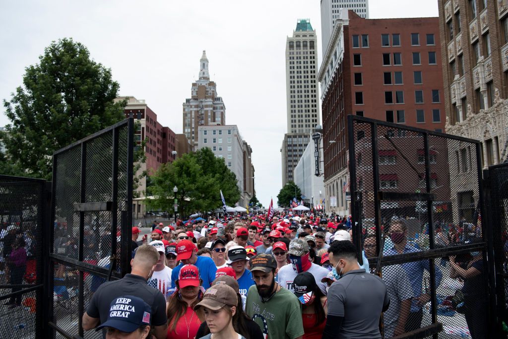 People wait at a security checkpoint to attend a rally with US President Donald Trump later in the evening at the BOK Center on June 20, 2020, in Tulsa, Oklahoma.