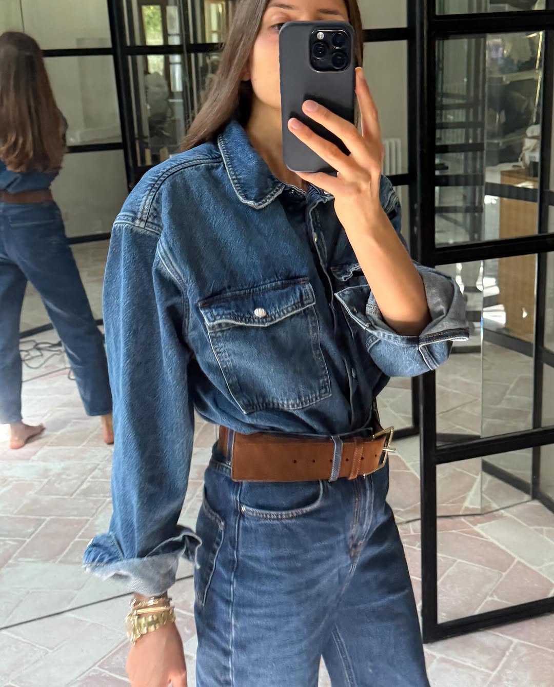 Woman wearing denim on denim outfit fall 2025.