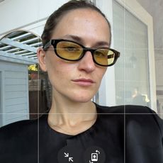 Eliza Huber wearing Alo's new yellow-lens Skinny Oval Sunglasses.