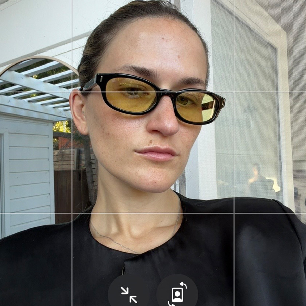 Eliza Huber wearing Alo's new yellow-lens Skinny Oval Sunglasses.