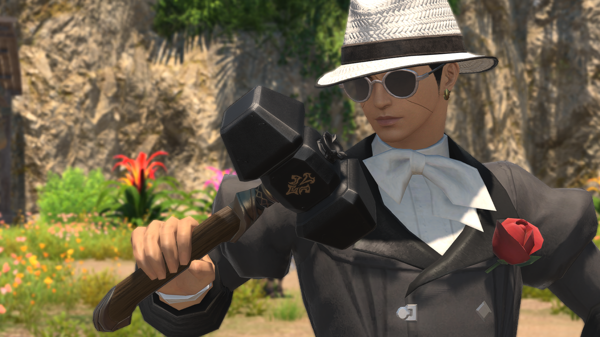 A crafter in Final Fantasy 14 inspects his hammer, preparing to create Archeo Kingdom gear.