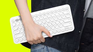 Woman holiding Logitech portable keyboard