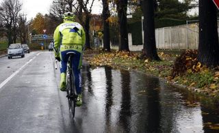 A long way from the podium in Milan, Ivan Basso (Liquigas) steers clear of a puddle.
