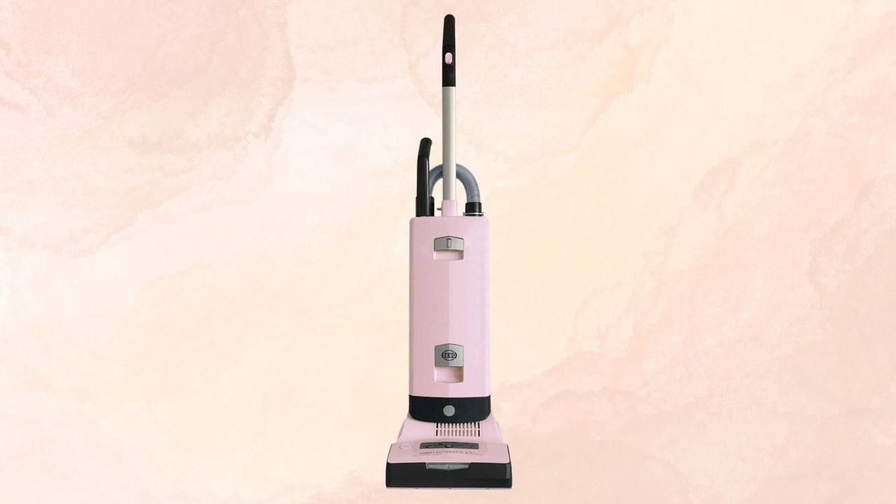 The SEBO Automatic X7 Vacuum on a pink and yellow marble background