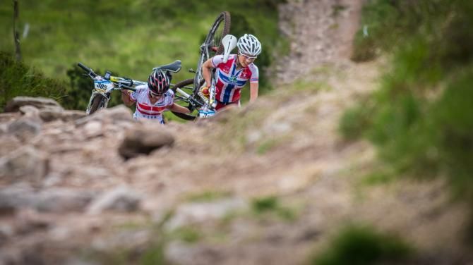 Racers hike a bike