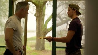 (L to R) Gary Weeks as Luke being handed a letter by Rudy Pankow as JJ