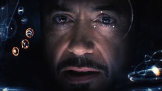 Tony Stark looking at interior helmet display in Age of Ultron