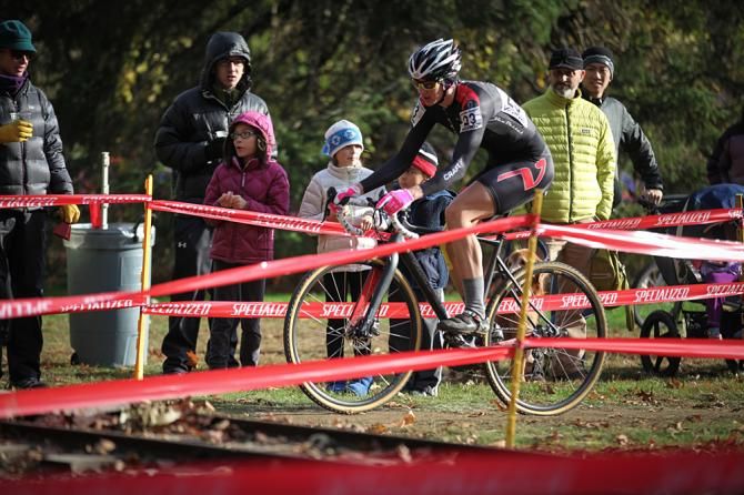 Spectators watch Maximenko riding away from the field