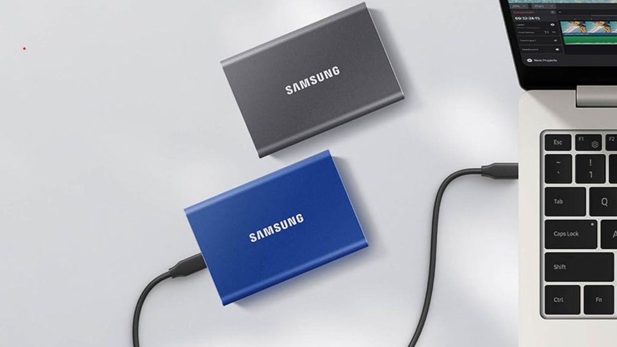 Samsung T7 SSDs next to laptop