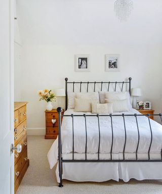 bedroom with metal bed and white bedsheet