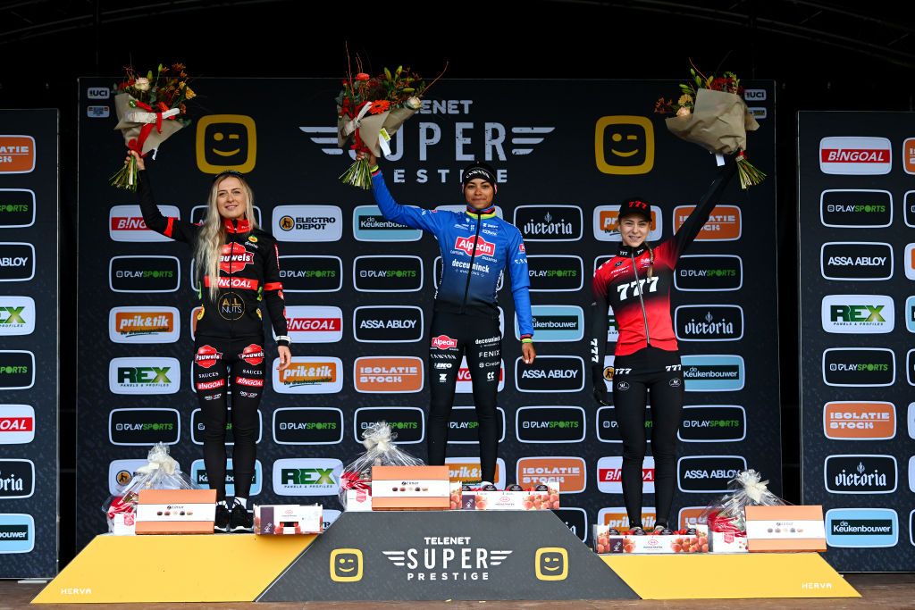 RIJKEVORSEL BELGIUM NOVEMBER 19 LR Denise Betsema of The Netherlands and Team Pauwel Sauzen Bingoal on second place race winner Ceylin Del Carmen Alvarado of The Netherlands and Team Alpecin Deceuninck and Inge Van Der Heijden of The Netherlands and Team 777 on third place pose on the podium ceremony after the 36th Superprestige Merksplas 2022 Womens Elite Superprestige2023 CXWorldCup CycloCross on November 19 2022 in Rijkevorsel Belgium Photo by Luc ClaessenGetty Images