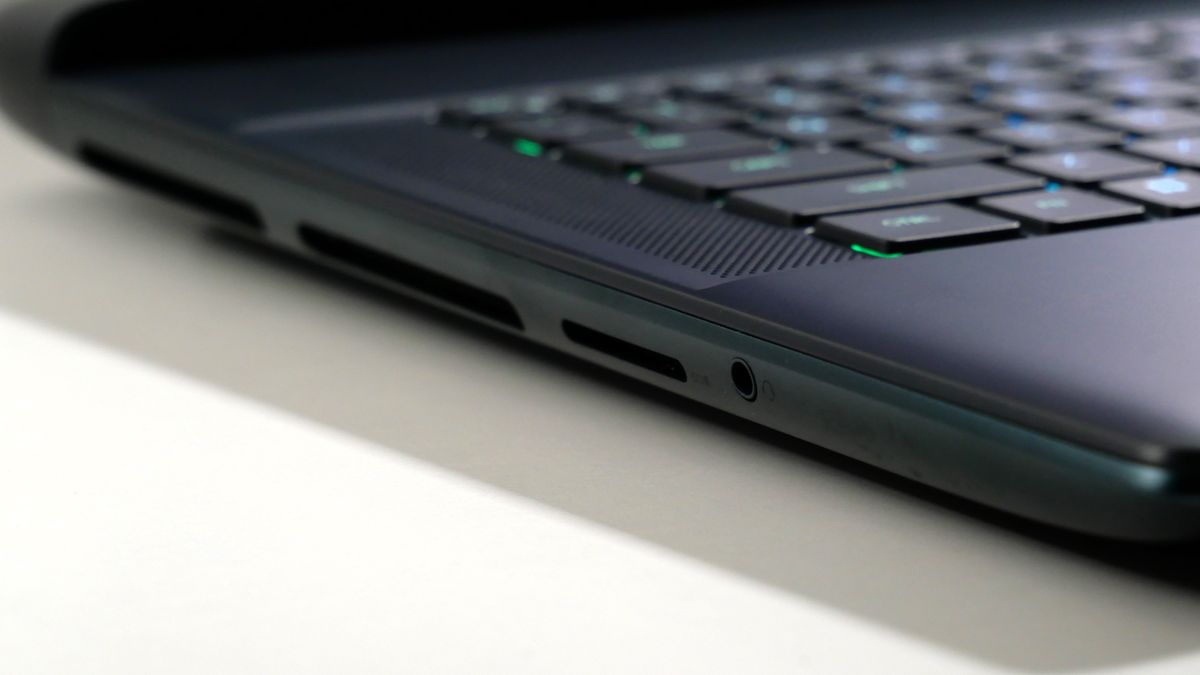 Alienware 16 Area-51 (RTX 5080) open on a white desk, highlighting the ports on the left.