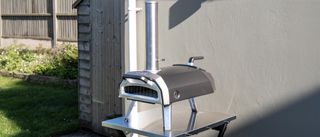 Ooni Karu 2 pizza oven outdoors on a table