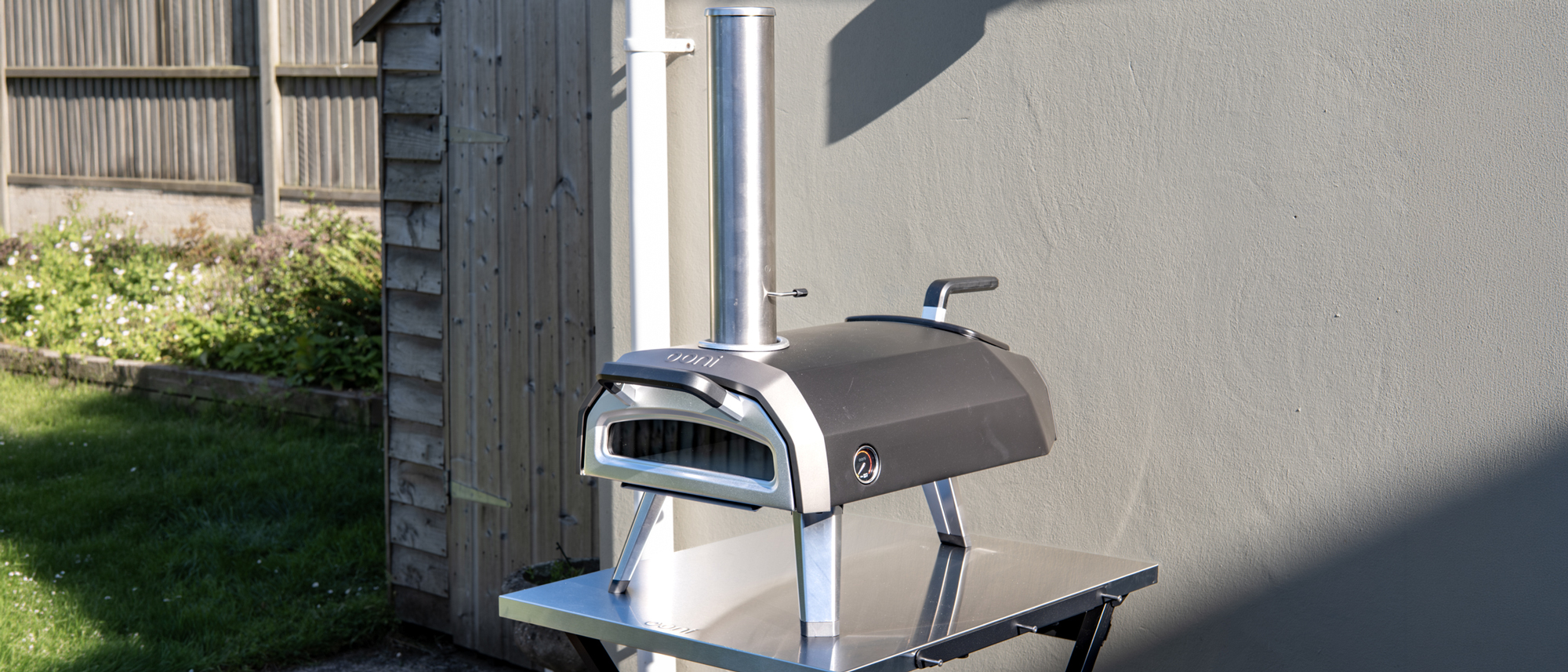 Ooni Karu 2 pizza oven outdoors on a table