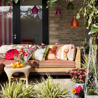 garden sitting area with brick wall and sofa