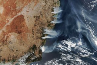 Wildfires have been raging across the southern and eastern states of Australia since October, and new imagery from the NOAA-NASA Suomi NPP weather satellite show plumes of smoke billowing from multiple fires near the coast of New South Wales. Another Suomi-NPP image captured in November show smoke from Australia's wildfires being swept across the South Atlantic Ocean, and that smoke has since spread to halfway around the world, NASA officials said in a statement. The satellite acquired this image on Wednesday (Dec. 4) at 2:45 p.m. local time, when there were 116 actively burning bush and grass fires in New South Wales alone.