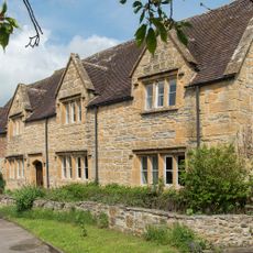 exterior of a cotswolds cottage with honey coloured stone
