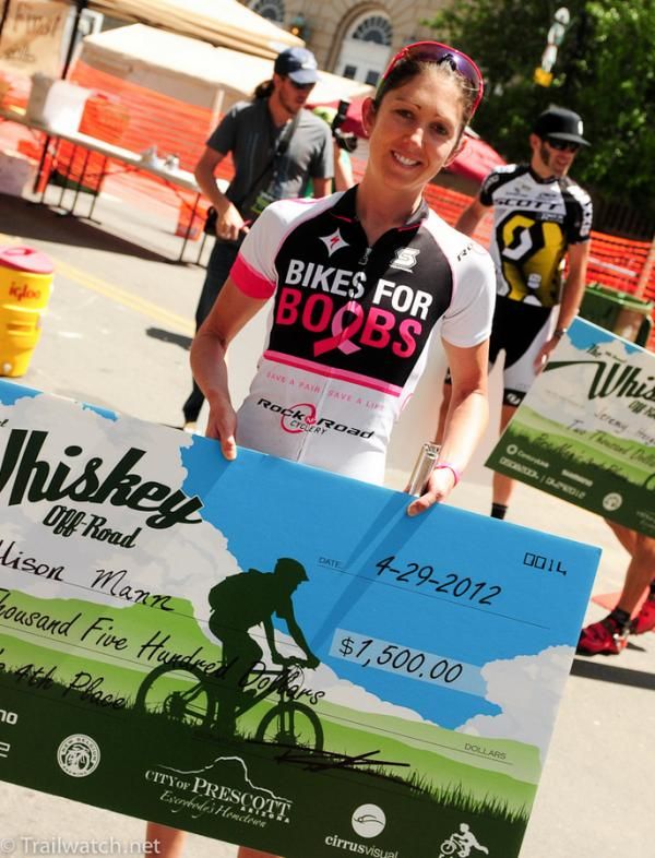 Alison Mann showing off her check for fourth place