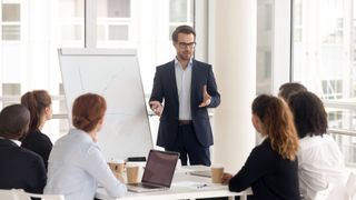 A man leading a business meeting