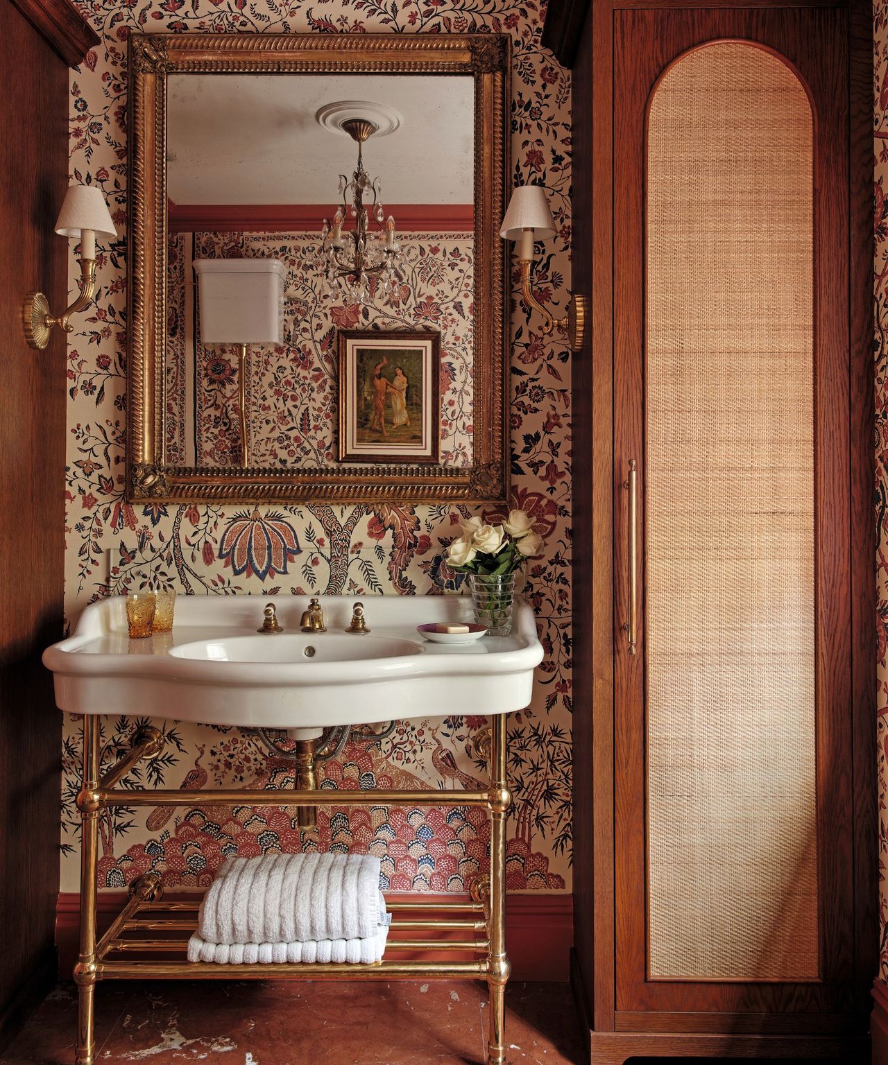bathroom with classical style sink and rattan fronted wardrobes