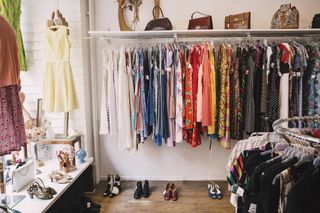 Best charity shops: A rail of secondhand clothes in a charity shop