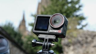 The DJI Osmo Action 5 Pro against an outdoors background