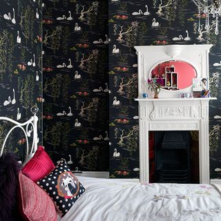 girls bedroom with chandelier black decorative feature wallpaper and mirror