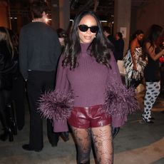 sierra mayhew, fashion editor, wearing flat knee high stretch boots