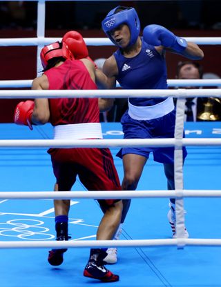 Jonas (right) became the first British female boxer to compete at the Olympics at London 2012 (Nick Potts/PA).