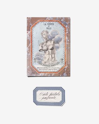 La Venus de Milo scented postcard featuring a statue of the torso and head in the card's centre.
