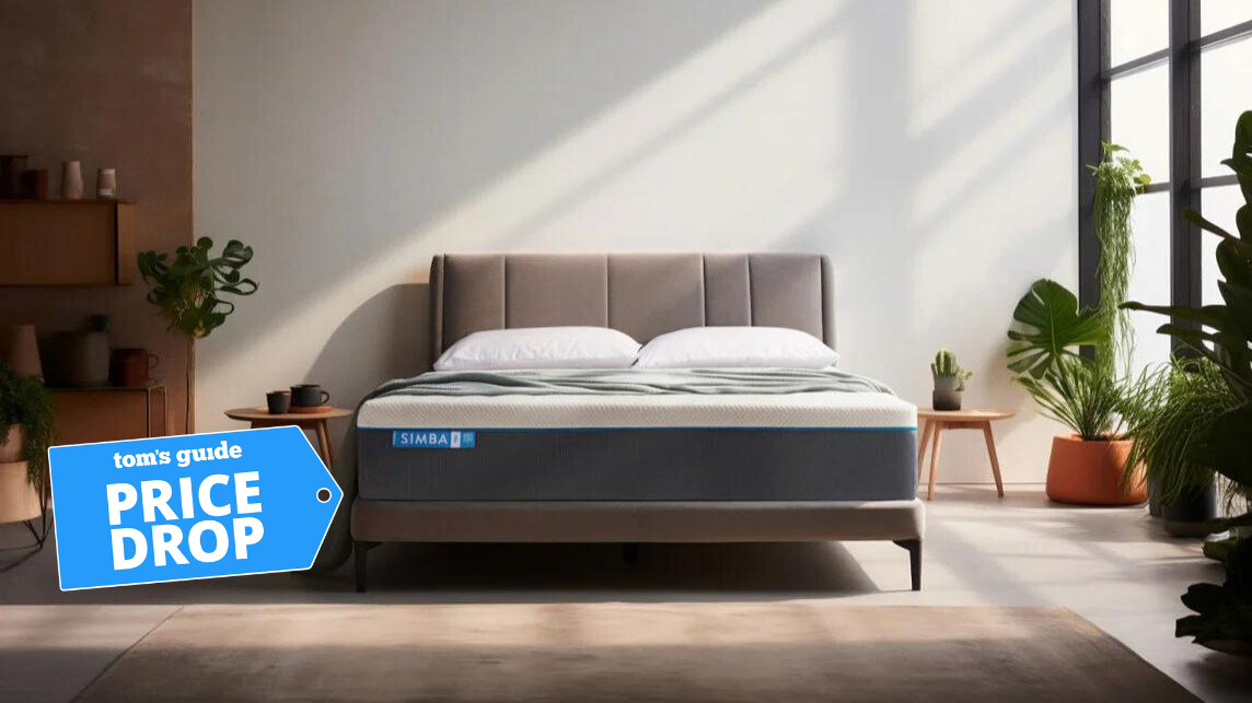 The Simba Hybrid Pro Mattress on a bed in a white bedroom on a bright winter&#039;s morning with a blue price drop badge overlaid on the bottom left hand corner of the image