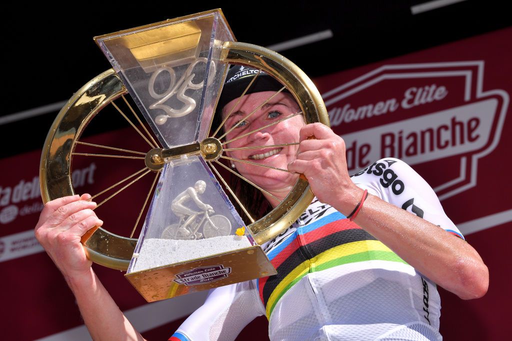 SIENA ITALY AUGUST 01 Podium Annemiek Van Vleuten of The Netherlands and Team Mitchelton Scott World Champion Jersey Celebration Trophy during the Eroica 6th Strade Bianche 2020 Women Elite a 136km race from Siena to Siena Piazza del Campo StradeBianche on August 01 2020 in Siena Italy Photo by Luc ClaessenGetty Images