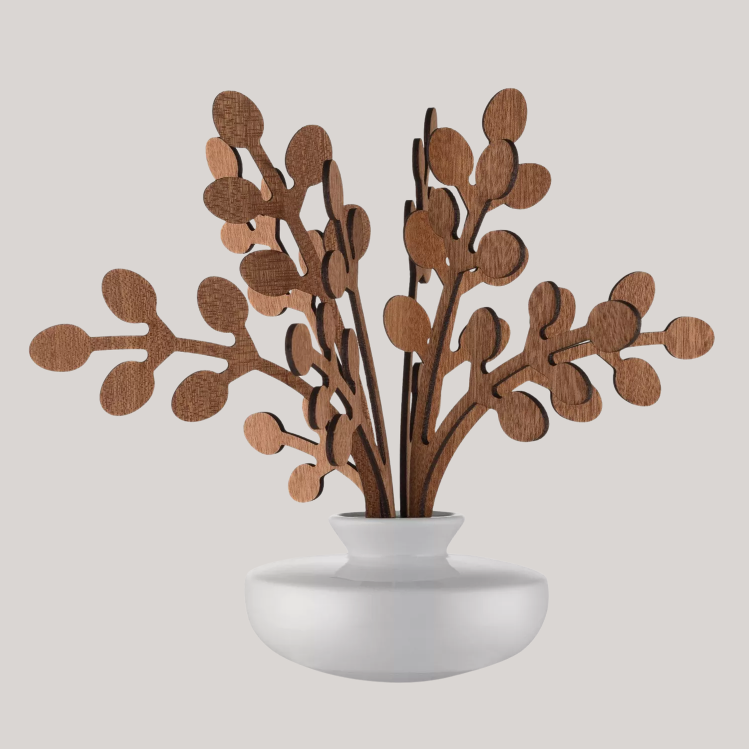 A diffuser with leafy wooden reeds