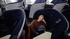 Woman lies back in new Finnair Business Class seat by PriestmanGoode